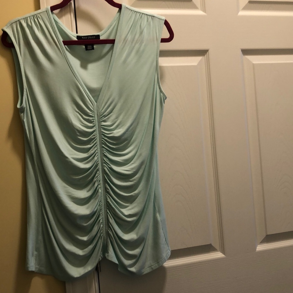 Sleeveless lightweight rayon/spandex top.